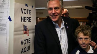 Democratic Virginia Gov. Terry McAuliffe and his son Peter leave a polling station after he casted his vote on Election Day, Nov. 5, 2013, in McLean, Va. Alex Wong/Getty Images