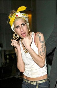 Illustration for article titled Winehouse + Cavalli = Animal Prints And Cigarettes