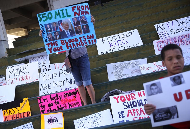 People join together after the Parkland, Fla., school shooting that killed 17 to protest against guns on the steps of the Broward County federal courthouse on Feb. 17, 2018, in Fort Lauderdale, Fla. (Joe Raedle/Getty Images)