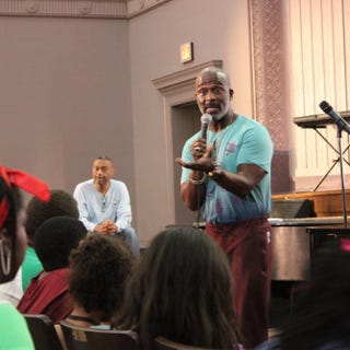 Famed gospel artist BeBe Winans addressing students attending the Children of the Gospel Choir Vocal Workshop at Deal Middle School in Washington, D.C. Washington Performing Arts.
