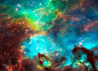 Illustration for article titled Birthing Stars Tear Into A Nebula With A Fierce Beauty