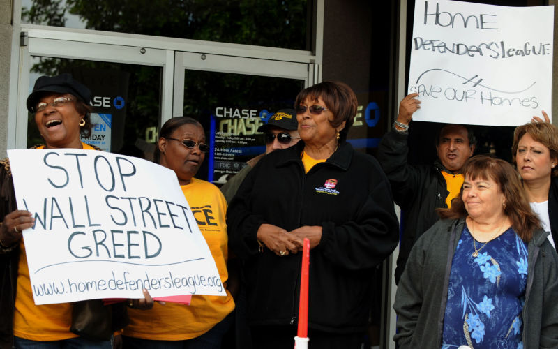 Homeowners rally at a bank (Getty)