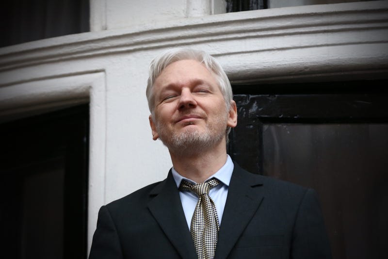 WikiLeaks founder Julian Assange, who may or may not have sexual relations with automobiles, appears at the Ecuadorian embassy in London in February 2016 (Photo by Carl Court/Getty Images)