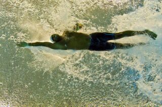Olympic gold-medal swimmer Cullen Jones competes in the men’s 50-meter freestyle preliminaries at the Pan American Games July 17, 2015, in Toronto.DAMIEN MEYER/AFP/Getty Images