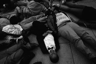 Schoolchildren from the Potomac Preparatory Charter School take part in a die-in during a protest outside the Office of Police Complaints as part of a planned “28 Hours for Mike Brown” protest Nov. 25, 2014, in Washington, D.C.Win McNamee/Getty Images