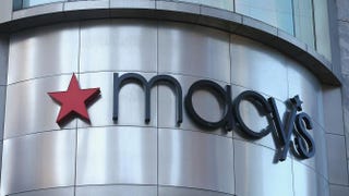 A sign hangs above Macy’s in the Magnificent Mile shopping district Aug. 14, 2013, in Chicago. Scott Olson/Getty Images