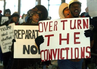 Protesters march in front of city court in New York 05 December, 2002 over five men charged with the 1989 sexual assault on a jogger in Central Park.DOUG KANTER/AFP/Getty Images