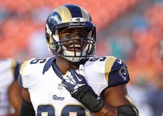 Defensive end Michael Sam #96 of the St. Louis Rams reacts during pregame workouts before his team met the Miami Dolphins at Sun Life Stadium on August 28, 2014 in Miami Gardens, Fla.Marc Serota/Getty Images
