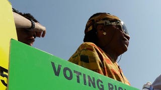 Supporters of the Voting Rights Act listen to speakers discussing the rulings outside the Supreme Court on June 25, 2013, in Washington, D.C.Win McNamee/Getty Images