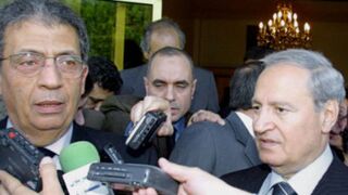 Arab League chief Amr Moussa (L), Syrian VP Farouq al-Sharaa (R) (Louai Beshara/AFP/Getty)