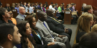 Court spectators listen to the verdict in the George Zimmerman trial. (Getty Images)