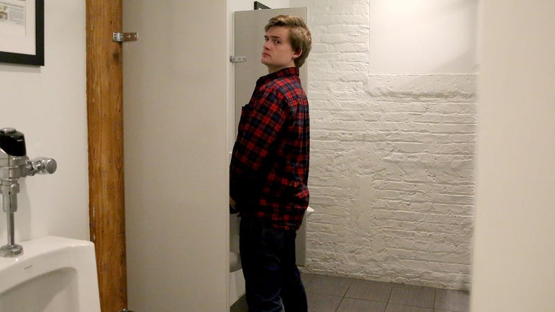 Illustration for article titled Brilliant Strategy: This Man Is Pretending To Piss For A Little Longer At The Urinal So He Doesn’t Have To Talk To One Of His Coworkers Washing His Hands