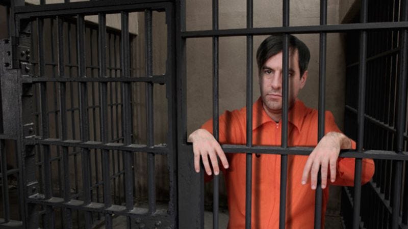 Inmate #29384 considers counting the bars again.