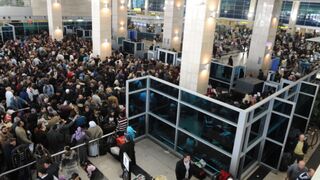 People crowd Cairo International Airport to escape Egypt crisis.