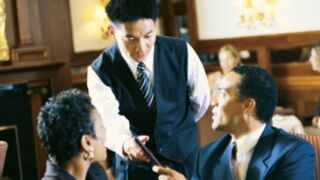 After enjoying a restaurant meal, do you tip? Tell us by taking our poll! (iStockphoto)