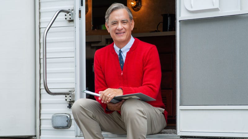 Illustration for article titled Tom Hanks Recalls Arriving On ‘A Beautiful Day In The Neighborhood’ Set At Dawn For Grueling 6-Hour Cardigan-Application Process