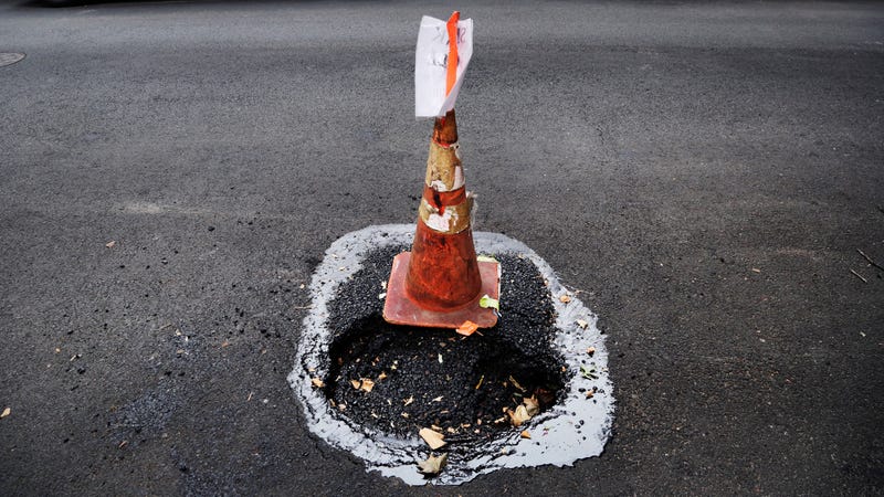 Illustration for article titled These Outlaws Are Fixing Potholes