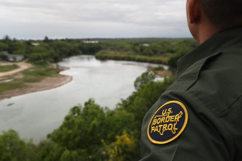 A U.S. Border Patrol agent scans the U.S.-Mexico border while on a bluff overlooking the Rio Grande on March 13, 2017. (John Moore/Getty Images)