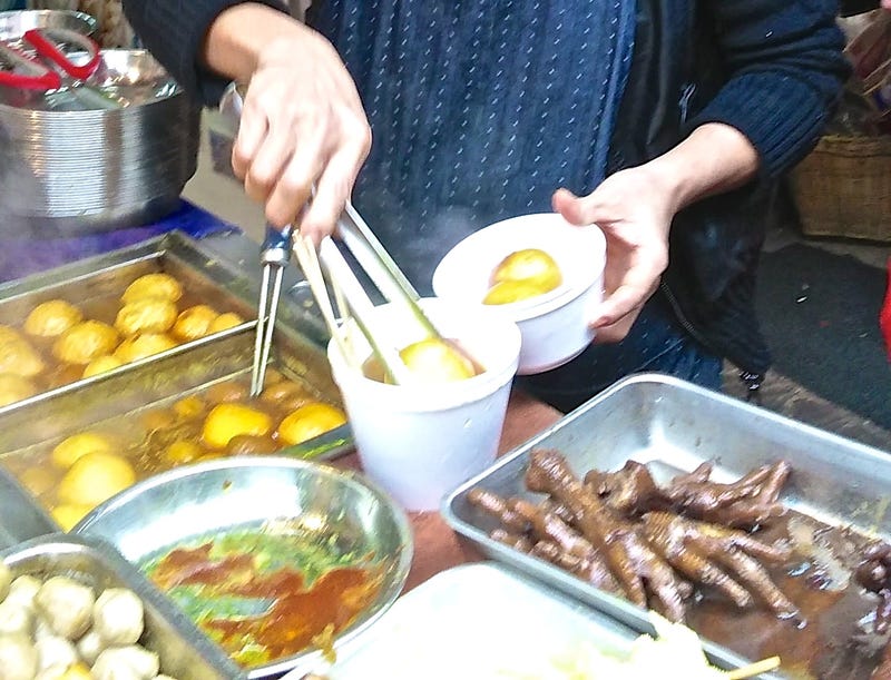 Yes those are stewed chicken feet on the right.