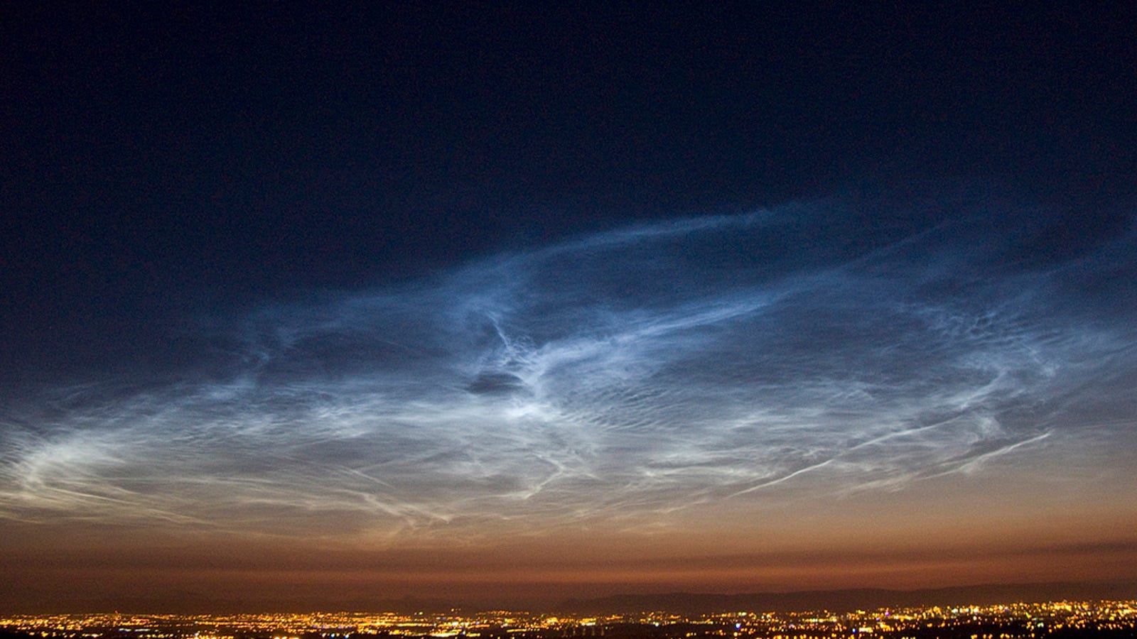 Glowing "Meteor Smoke" Clouds Appear Over Antarctica