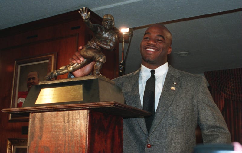 Running back Rashaan Salaam with the Heisman Trophy after being named the 60th winner of the award at the Downtown Athletic Club in New York City on Dec. 10, 1994Jed Jacobsohn/Getty Images