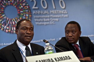 Sierra Leone Finance Minister Samura Kamara and Kenya's Uhuru Kenyattaat IMF/World Bank meeting. (Nicholas Kamm/AFP/Getty)