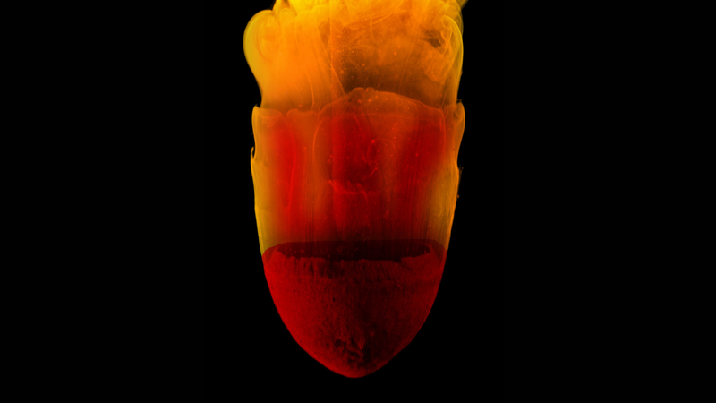 A mock meteorite falling through liquid.