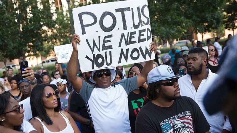 People rally in Dallas on July 7, 2016, to protest the deaths of Alton Sterling and Philando Castile.Laura Buckman/AFP/Getty Images