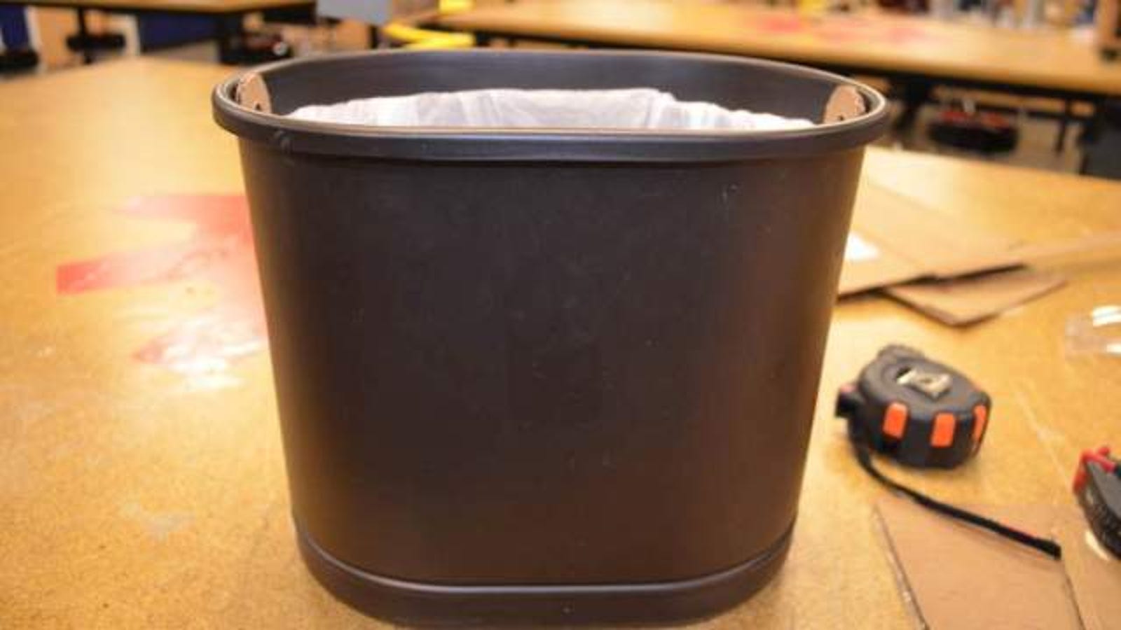 Keep Bags From Falling Into Trash Cans With A Cardboard Insert