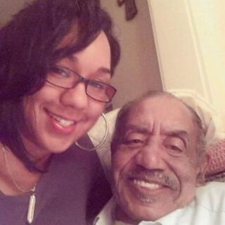 Medric Mills and granddaughterFacebook