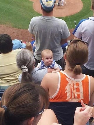 Illustration for article titled Angry Baby Royals Fan Mean-Mugs Tigers Fan, Gives Her The Finger