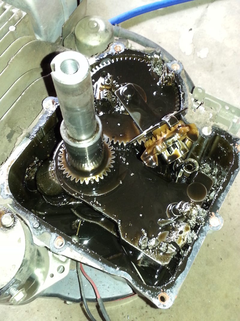 Illustration for article titled The bits and pieces of my broken mower engine.
