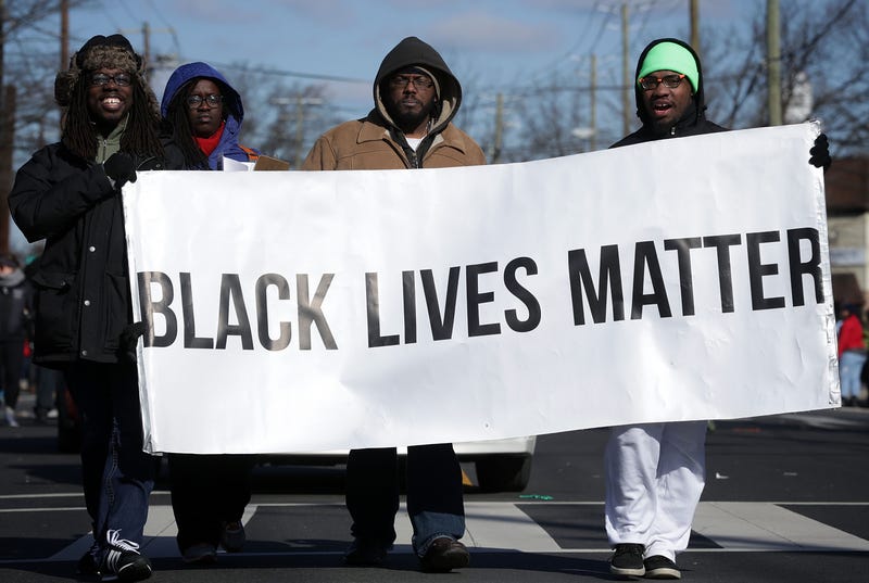 Members of Black Lives Matter DMV participate in the annual Martin Luther King Holiday Peace Walk and Parade January 18, 2016 in Washington, DC.