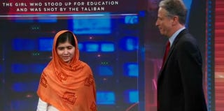 Malala Yousafzai is greeted by Jon Stewart on The Daily Show. (Screenshot from The Daily Show/Comedy Central)