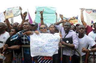 Workers carry placard to campaign for the release of schoolgirls kidnapped by Boko Haram Islamist terrorists almost a month ago during worker's rally in Lagos, Nigeria, on May 1, 2014.PIUS UTOMI EKPEI/AFP/Getty Images