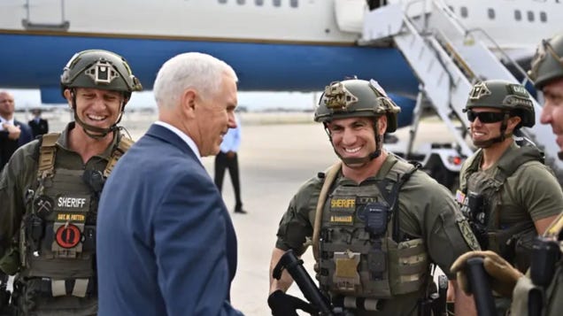 Mike Pence Tweets and Later Deletes Photo With Florida Sheriff's Deputy Sporting a QAnon Patch