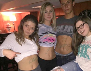 Four students at Grosse Pointe South High School in Michigan were suspended after this photo appeared on social media. Twitter