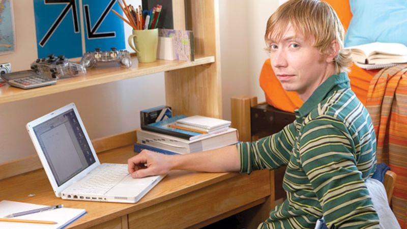 Melton puts the finishing touches on setting up his desk area without any interference from his parents.