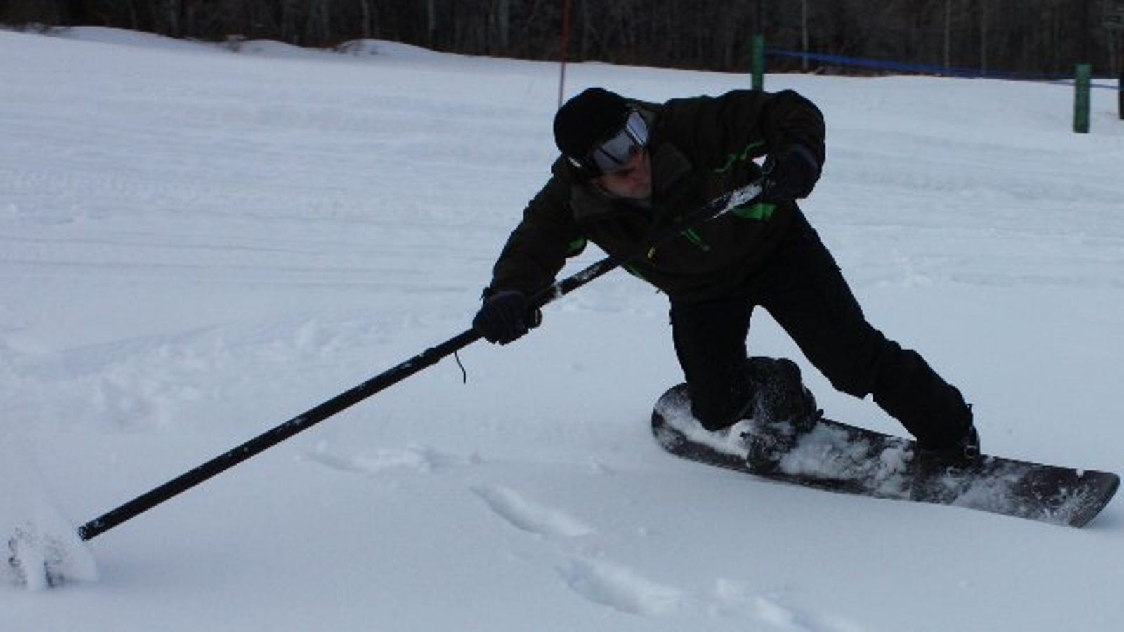 How to Carve and Paddle Your Way Down the Slopes with a Big Stick
