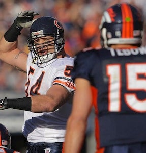 Illustration for article titled Brian Urlacher's Grudging Praise For Tebow: "He's A Good Running Back"