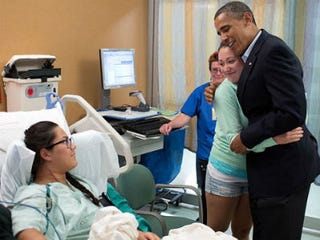 Obama with movie-theater shooting victims in Aurora (White House/Pete Souza)