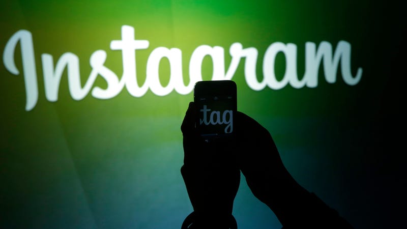 A journalist makes a video of the Instagram logo using the new video feature at Facebook headquarters in Menlo Park, Calif.