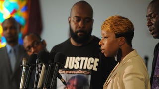Michael Brown’s mother, Lesley McSpadden, flanked by his father, Michael Brown Sr., speaks during a press conference at Jennings Mason Temple Church of God in Christ, Aug. 11, 2014, in Jennings, Mo.Michael B. Thomas/Getty Images
