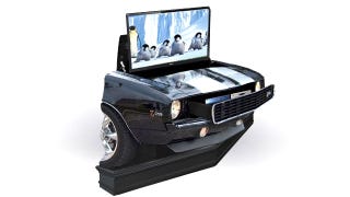 Illustration for article titled Ridiculous Home Theater Looks Like a Camaro Crashed Through Your Living Room Wall