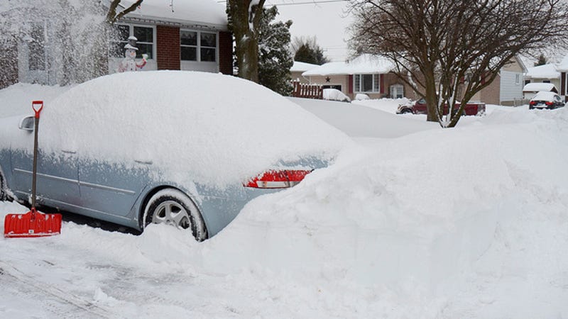 Car buried in snow Image source Snow
