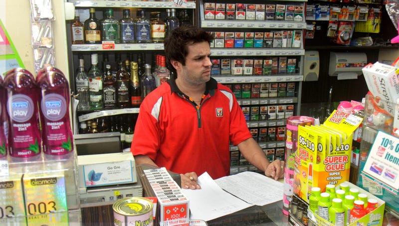 Illustration for article titled Customers Relieved To See Perky 7-Eleven Cashier’s Spirit Has Finally Been Crushed