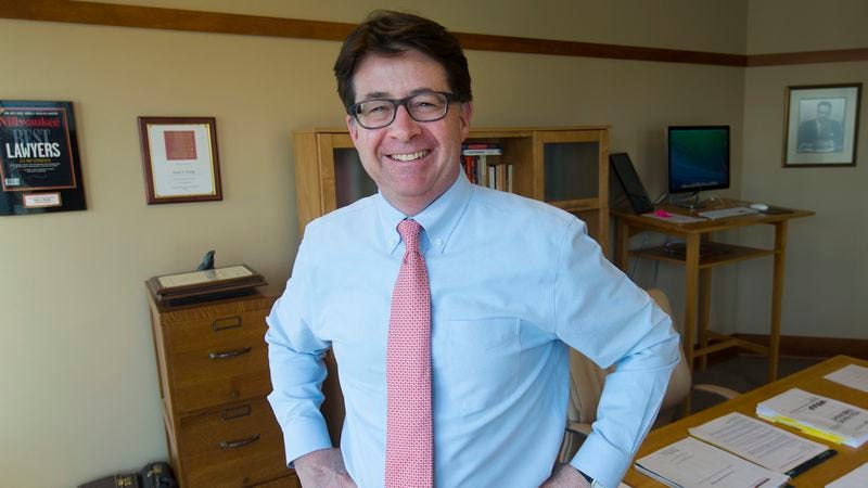 Strang, posing provocatively in his office in Madison, Wisconsin. (Photo: Getty Images)