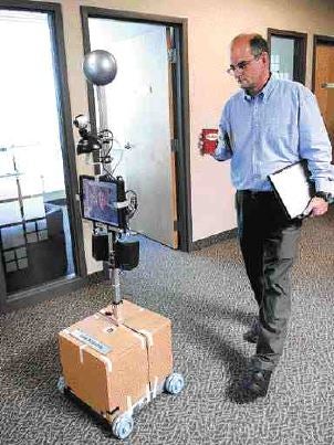 Illustration for article titled IvanAnywhere Robot Sits At Work For You