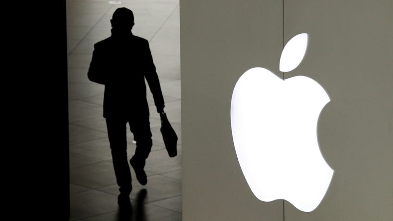 A man leaving an Apple store in Beijing, 2019.