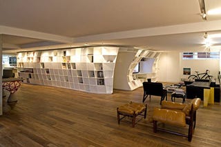 Illustration for article titled Giant Curvalicious Bookshelf Winds Its Way Through Your Apartment